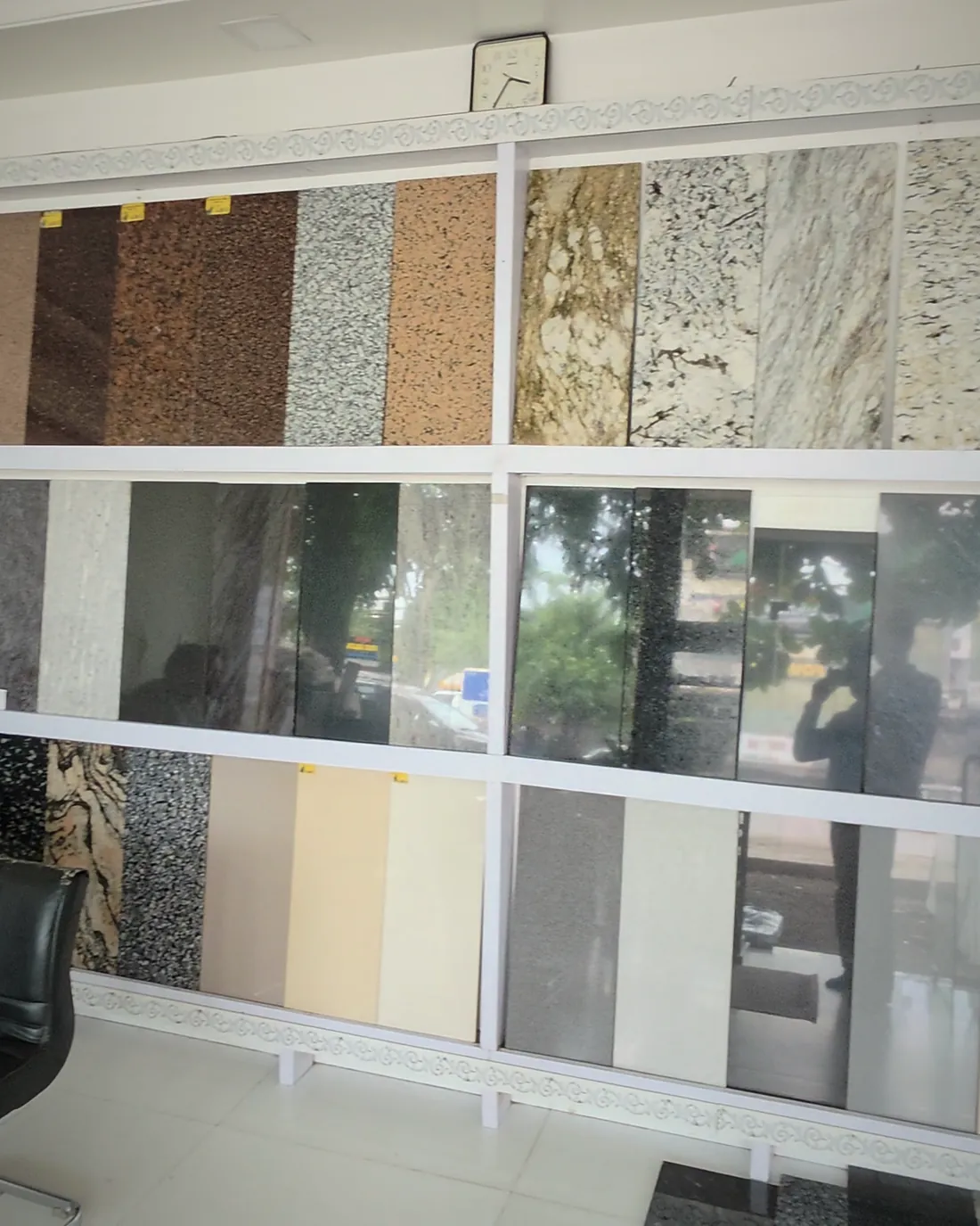 The showroom sample wall, panels of marble, granite and tile mounted in rows.